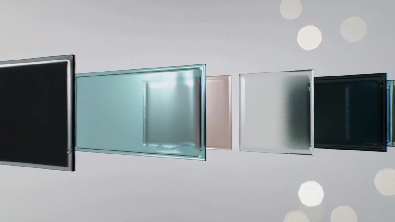 Animation playback sliding row of translucent glass panels across studio backdrop, creating depth