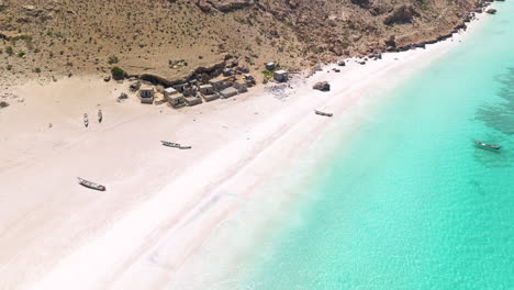 white sand and turquoise water of shoab beach in socotra island, yemen - aerial drone shot