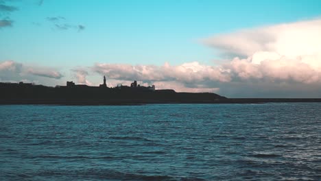 Ruins-castle-near-the-ocean-with-clouds