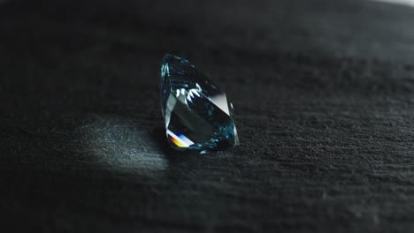 polished blue gemstone rotates and sparkles