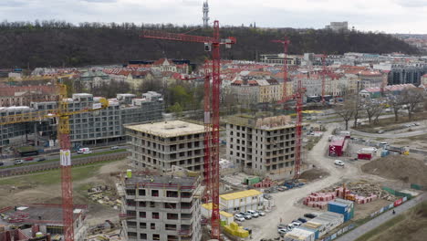 construction site in prague city with cranes and building material