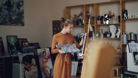 woman painting in an art studio