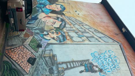 vertical view of the mural of the band los prisioneros at the open-air museum in san miguel, santiago, chile.
