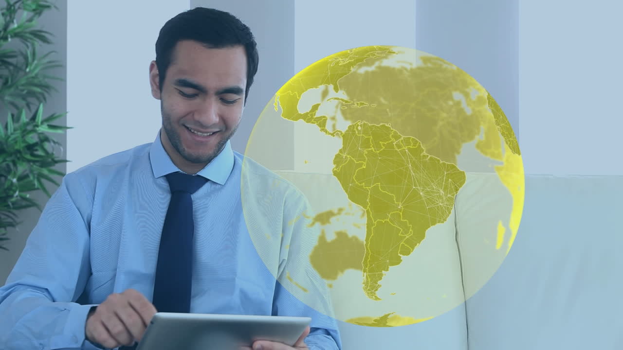 animación del globo sobre un hombre de negocios biracial usando una tableta