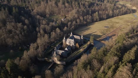 German-moated-castle-at-sunset-during-winter-in-central-Europe