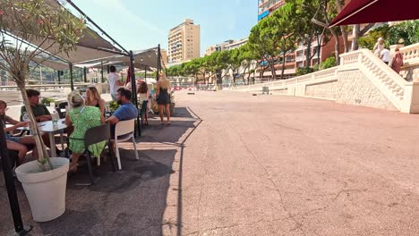 people relaxing at an outdoor cafe in monaco