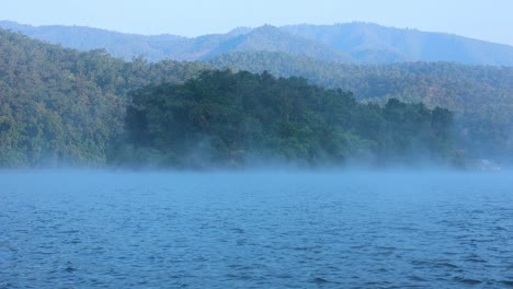 foggy river with mountains in chiang mai, thailand