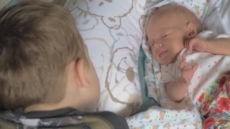 child looking after baby sister