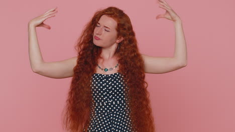 redhead woman showing nonsense hands gesture, gossips, empty fake promises, liars, pink background