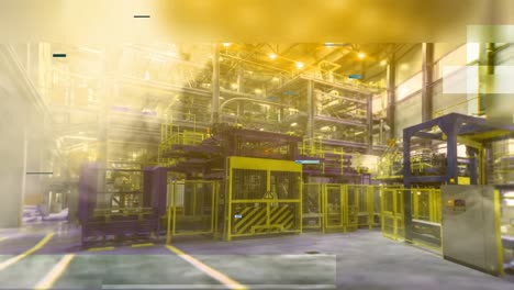 interior de una instalación industrial con humo e iluminación amarilla