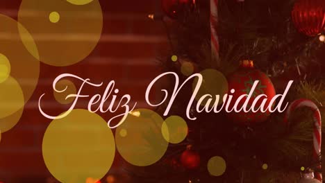 animation of yellow spots of light and feliz navidad text banner against a decorated christmas tree