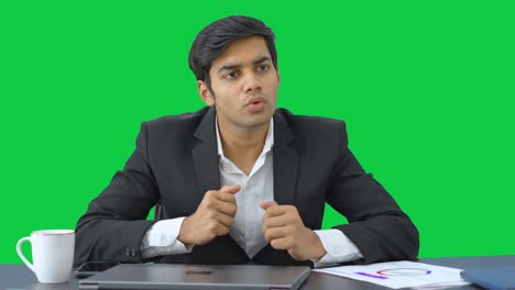 Indian-manager-motivating-employees-in-a-meeting-Green-screen