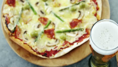 Delicious-pizza-with-a-glass-of-beer
