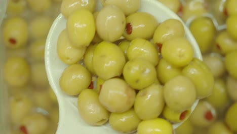 close-up of green olives in a dish