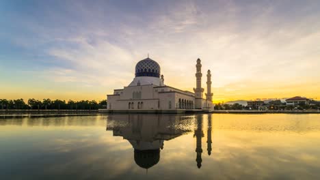the kota kinabalu city mosque with glorious sunrise color and dramatic cloud. time lapse footage