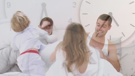 Clock-animation-over-family-playing-and-laughing-in-bed,-enjoying-quality-time