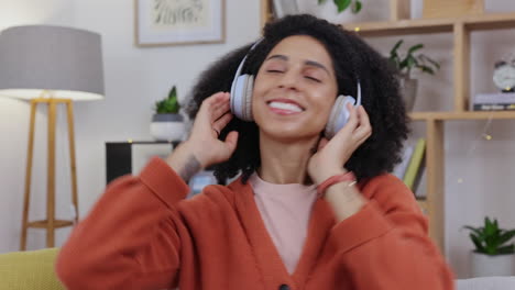 woman, dance and music with headphones on a living