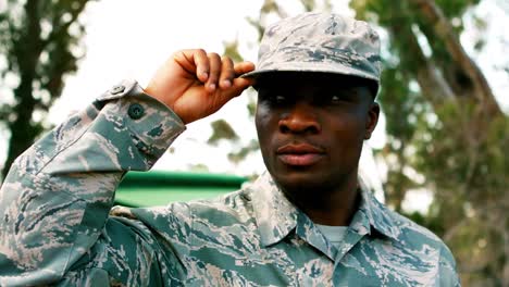 military man holding his cap