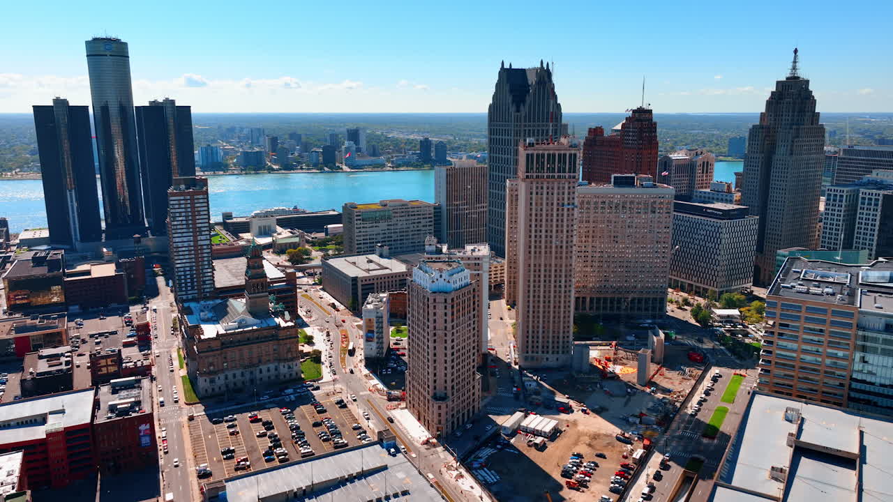 Detroit, USA, 28 July 2025: Footage above the downtown of Detroit, Michigan, USA. Lots of parking lots in the cityscape. River waterscape at backdrop