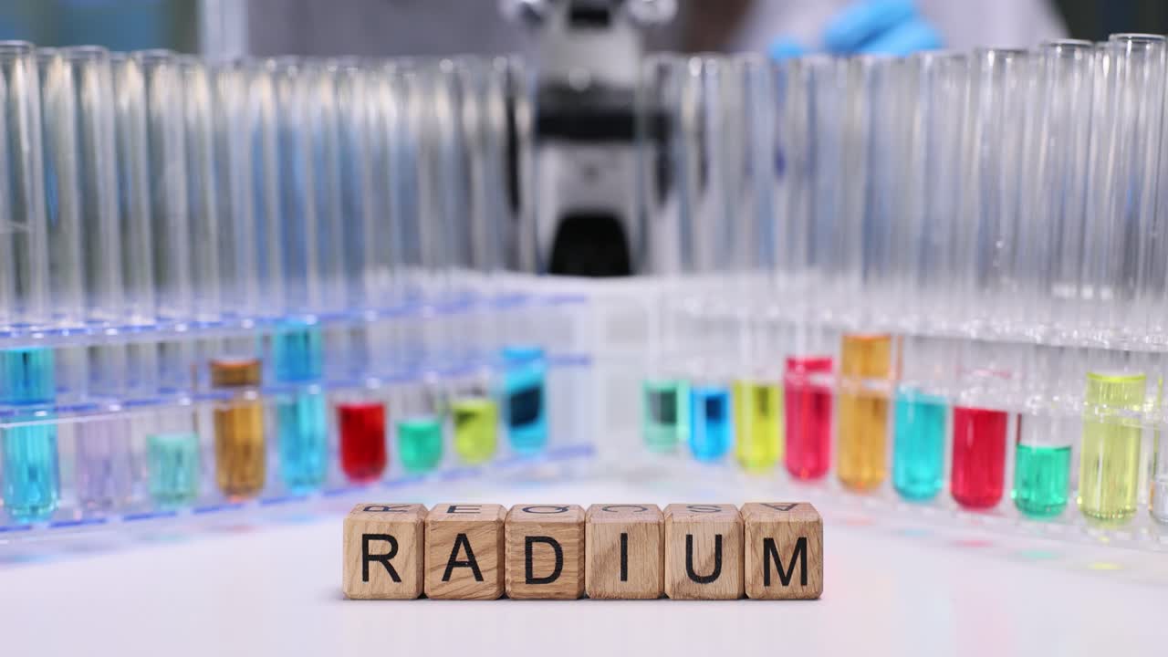 Radium Element on Wooden Blocks in a Chemistry Laboratory with Colorful Test Tubes