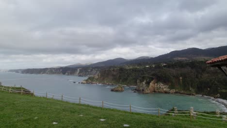 Aerial-shot-of-a-horreo,-traditional-granary-from-the-north-of-Spain-in-a-cliff-next-to-the-sea