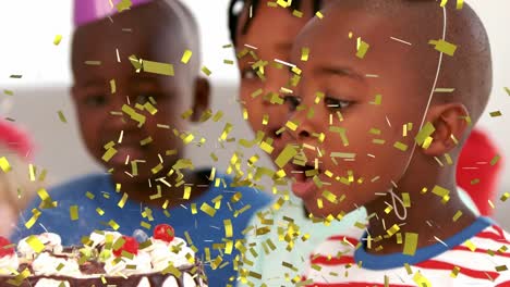 Animation-of-confetti-falling-over-boy-blowing-candle-on-birthday-cake-surrounded-by-friends