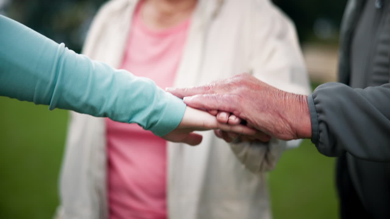 Intergenerational Hands Touching in Support and Unity