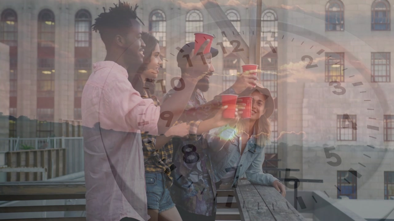 Friends toasting red cups at rooftop sunset event after one lifting cup, clock face overlapping