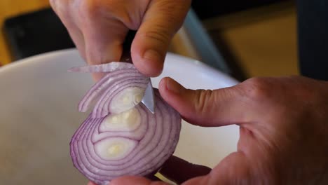 cutting an onion - making a salad in an italian kitchen 60fps slow motion