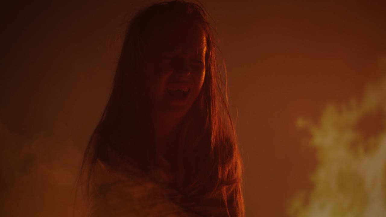 Emotional journey of a young person in a fiery setting