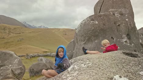 two young brothers explore the great wilderness of castle hill on new zealand's south island on a family day out.