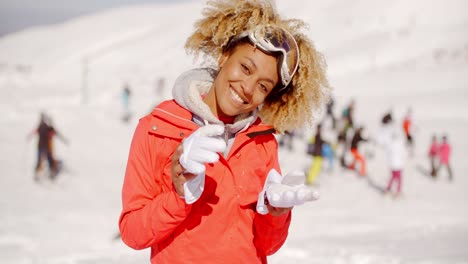 carefree young woman with hands up