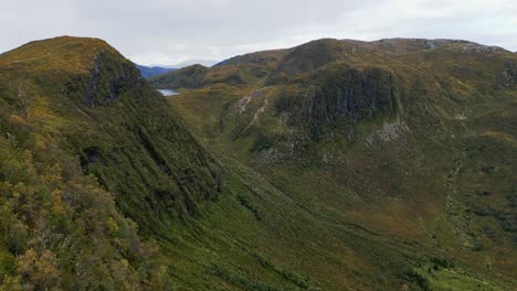 Aerial-over-the-rugged-hills-and-lakes-near-Vanylven-Municipality,-Norway