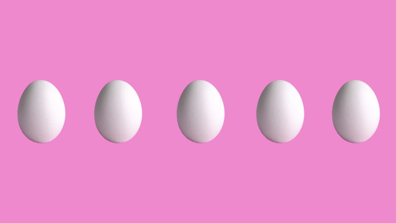 funny animation with chicken raw eggs on rose and pink background, close-up. side view of farm products, easter concept with copy space