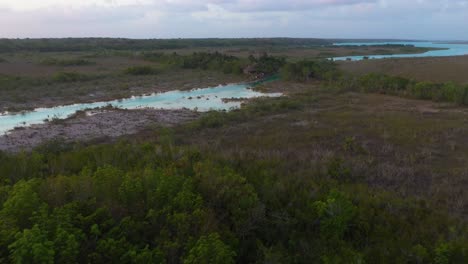 resort in mexico lagoon los rapidos de bacalar, 4k aerial sunset view