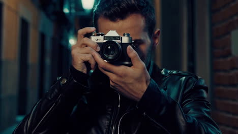 photographer at night in city streets