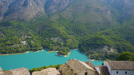 spanish village with turquoise lake