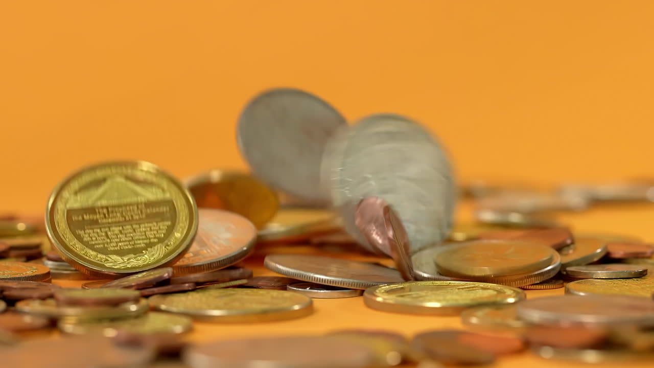 Shiny gold coins falling, financial saving grow concept of wealth banking investment economy success of finance business, monetization of ideas, abundance wealth prosperity motion