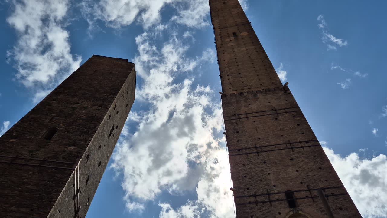 Due Torri, Asinelli and Garisenda, the Two Towers in Bologna, Italy, tilt up shot