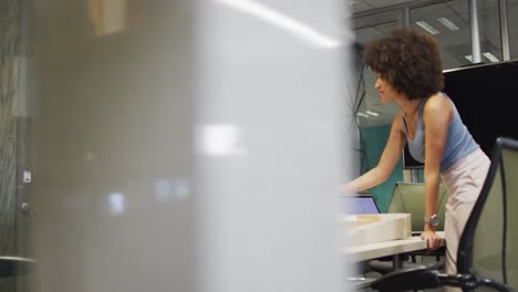 video of focused diverse male and female designers working and talking