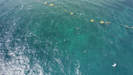 aerial revealing shot of the debris on the sea surface