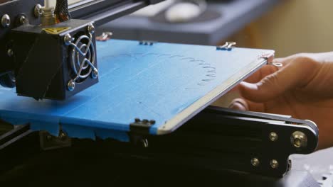 Mechanic using die machine on table 4k