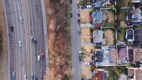 A-top-down-view-over-a-suburban-neighborhood-in-the-early-morning