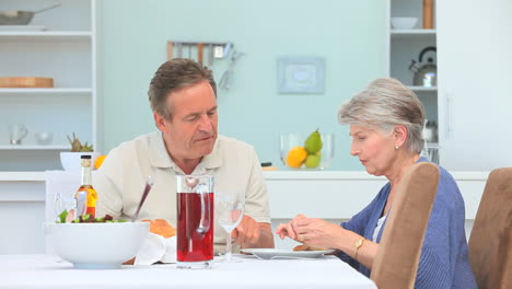 elderly couple eating