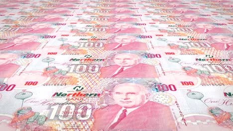 billetes de cien libras de irlanda del norte enrollados, dinero en efectivo
