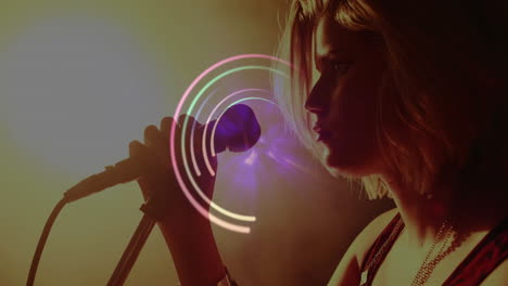 teenage girl singing on stage for music industry with animated light effects and floating icons