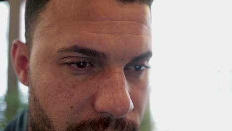 concentrated handsome man working in coffee shop