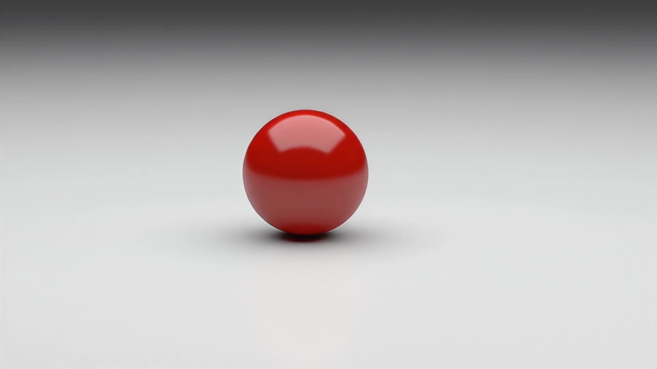 A Single Red Sphere Resting on a Smooth White Surface