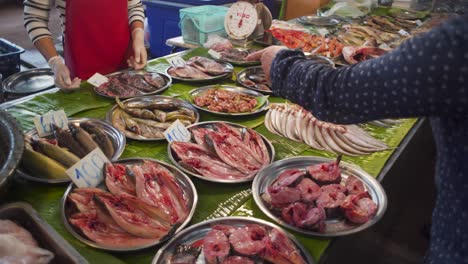 fish being sold at thai wet market food stall