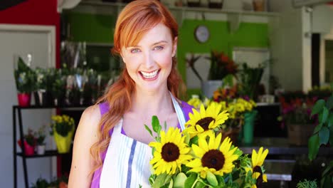 female florist holding bunch of flowers